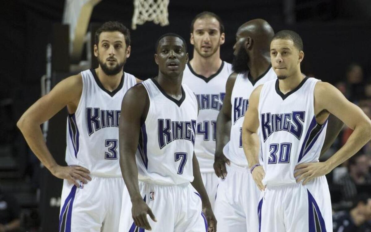 Sacramento Kings Marco Belinelli (3), Darren Collison (7), Kosta Koufos (41), and Seth Curry (30) wait for game to start after a timeout against the Boston Celtics on Thursday, Dec. 3, 2015 at Mexico City Arena in Mexico City. The bench players have had a front-row seat to the Kings’ roller-coaster ride this season.