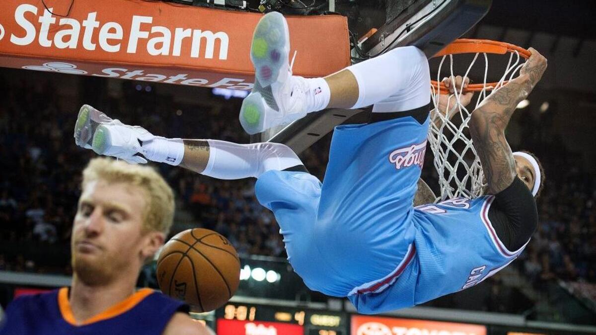 Kings center Willie Cauley-Stein dunks in the fourth quarter as the Suns’ Chase Budinger gets out of the way at Sleep Train Arena on Friday, March 25, 2016.