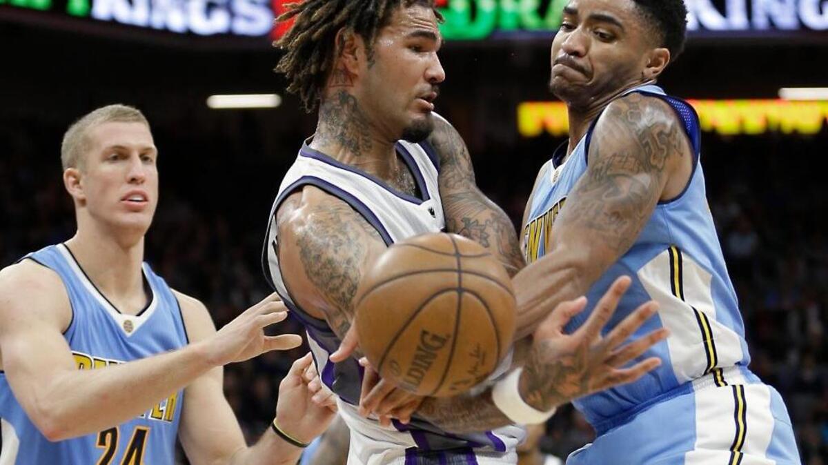 Denver’s Gary Harris, right, battles Kings center Willie Cauley-Stein for the ball at Golden 1 Center on Thursday, Feb. 23, 2017.
