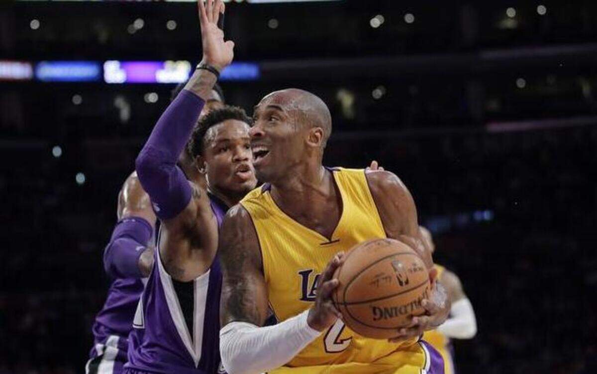 
Kobe Bryant, right, looking to score against Ben McLemore, and his Los Angeles Lakers teammates are back, looking on Sunday to make it two straight wins against the Sacramento Kings. 
