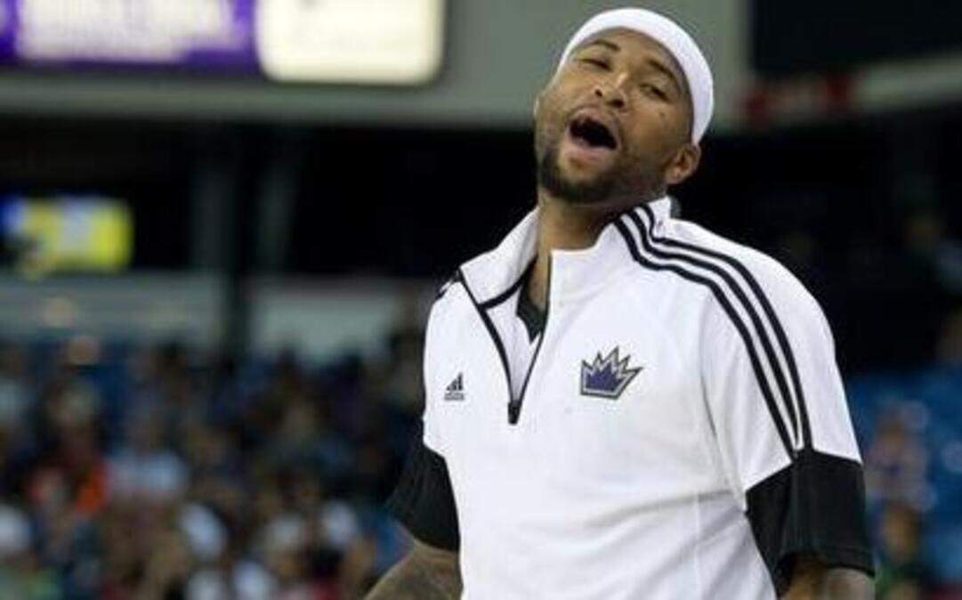  Kings center DeMarcus Cousins (15) cheers on teammates during a preseason game. They’ve noticed a difference in Cousins coming into this season that they hope will lead them to improvement.