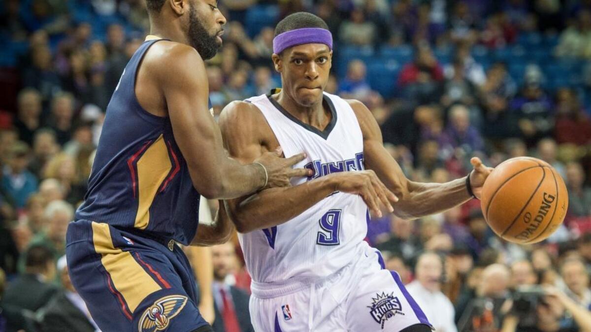 Kings guard Rajon Rondo (9) drives to the basket against New Orleans Pelicans guard Tyreke Evans on Wednesday night at Sleep Train Arena. Rondo finished with 17 points and 10 assists in the Kings’ 109-97 loss.