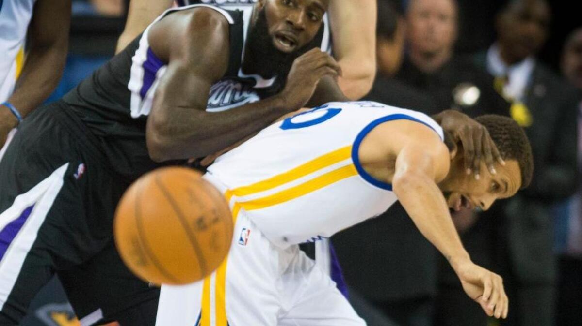 Kings forward Quincy Acy (13) defends Warriors guard Stephen Curry (30) during the first half at Sleep Train Arena on Saturday, Nov. 7, 2015 in Sacramento. Acy was part of the sixth starting lineup used by coach George Karl in seven games this season.
