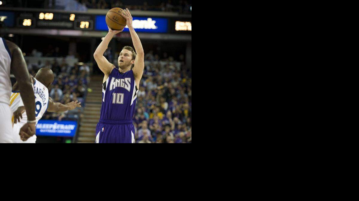 
Sacramento Kings guard Nik Stauskas (10) makes a shot against Golden State Warriors guard Leandro Barbosa (19) in the Kings season opener at Sleep Train Arena on Wednesday, October, 29, 2014 in Sacramento.
