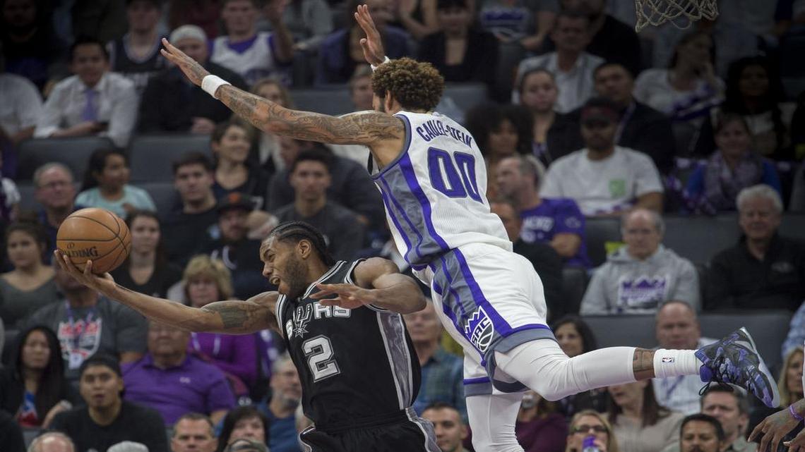 Sacramento Kings center Willie Cauley-Stein (00) defends San Antonio Spurs forward Kawhi Leonard (2) during their game at Golden 1 Center in Sacramento on Wednesday, November 16, 2016.