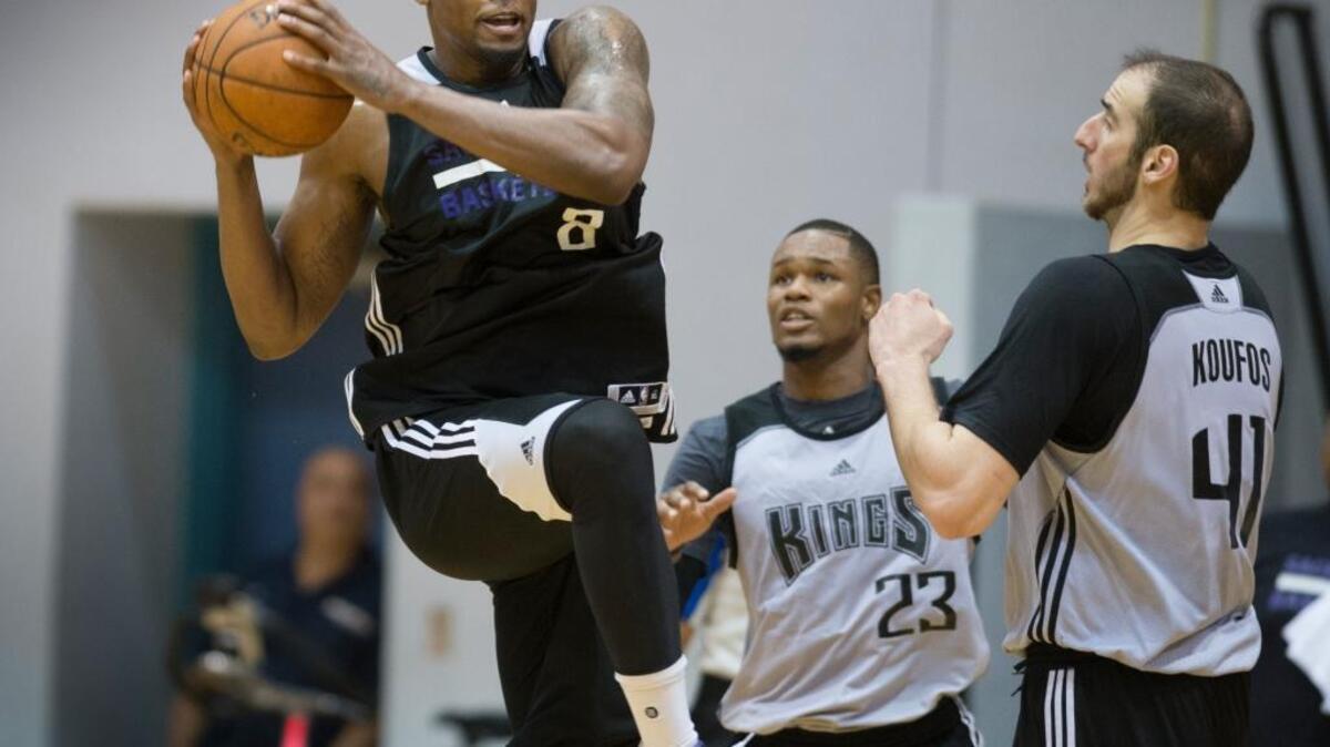Kings forward Rudy Gay looks to make a pass as he’s defended by Ben McLemore and Kosta Koufos (41) during training camp at UC San Diego’s RIMAC Arena on Oct. 1.