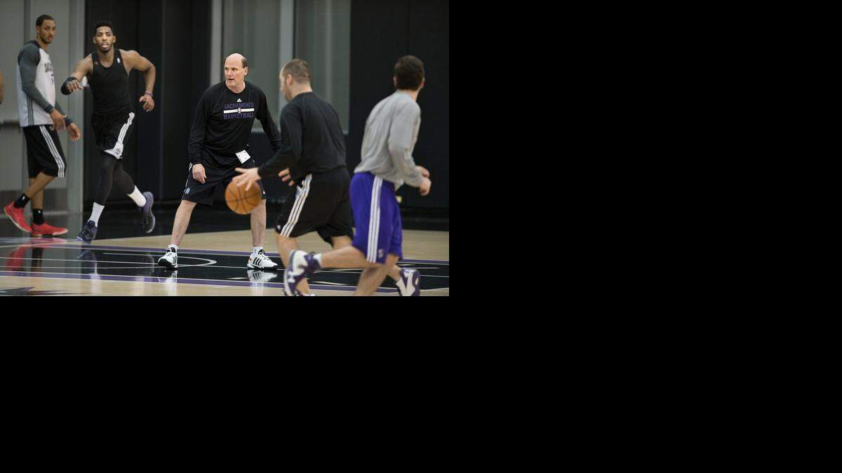 Newly hired Kings assistant coach Vance Walberg runs a drill at the team’s practice facility Tuesday. He created the dribble-drive motion offense as a high school coach.