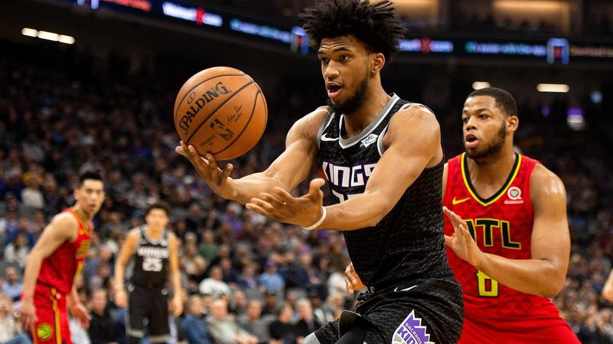 Sacramento Kings forward Marvin Bagley III (35) is covered by Atlanta Hawks forward Omari Spellman (6) as he tries to get control of the ball during a game at Golden 1 Center on Wednesday, January 30, 2019 in Sacramento.