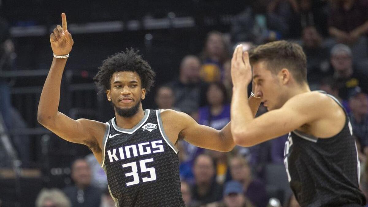 Rookie forward Marvin Bagley III (35) alerts the Kings’ bench after spraining his knee against the Golden State Warriors on Friday night, Dec. 14, 2018, at Golden 1 Center. The team said Bagley would be re-evaluated in 10-14 days.