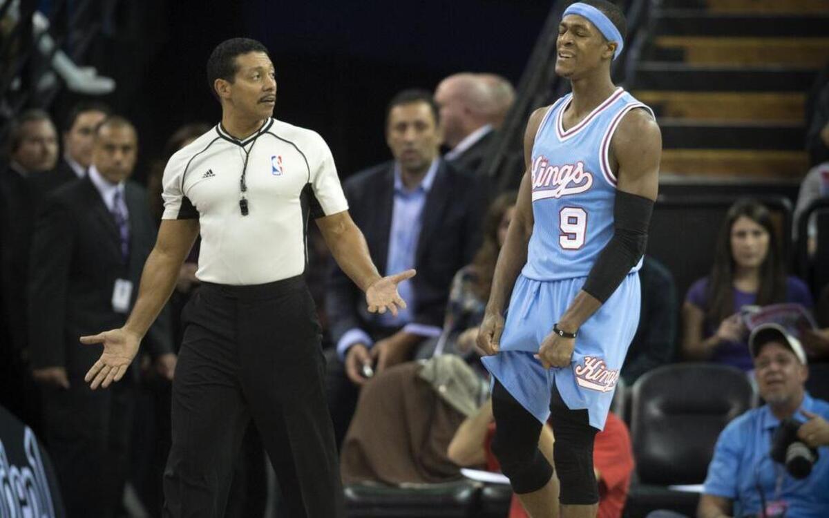 NBA referee Bill Kennedy (55) talks with Sacramento Kings guard Rajon Rondo (9) during the game against the Minnesota Timberwolves at Sleep Train Arena in Sacramento on Friday, Nov. 27, 2015.