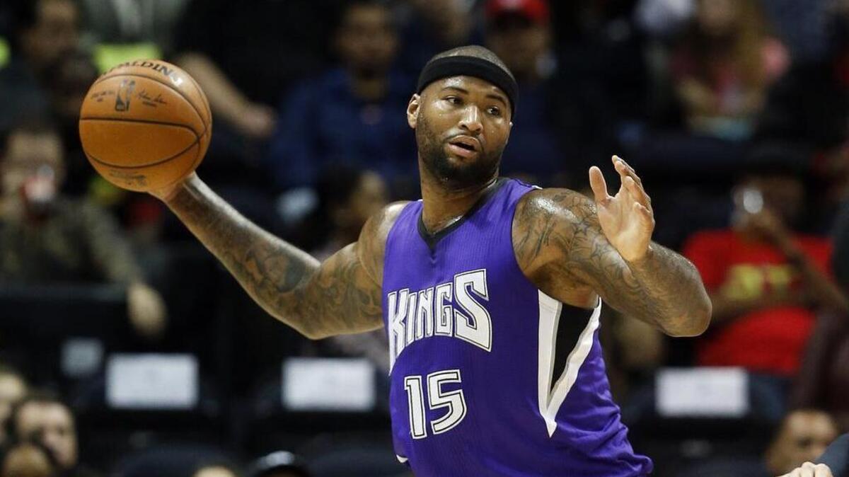 Sacramento Kings forward DeMarcus Cousins (15) grabs a rebound in the first half of an NBA basketball game against the Atlanta Hawks Wednesday, Nov. 18, 2015, in Atlanta.