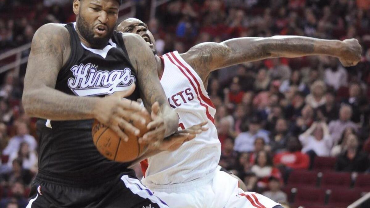 DeMarcus Cousins, left, leads the Sacramento Kings into action against the New York Knicks at Sleep Train Arena on Thursday, Dec. 10, 2015.