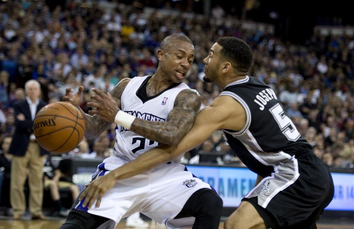 Sacramento Kings guard Isaiah Thomas has the ball stripped by San Antonio Spurs guard Cory Joseph (5) during an NBA basketball game, Friday, March 21, 2014 at Sleep Train Arena in Sacramento.