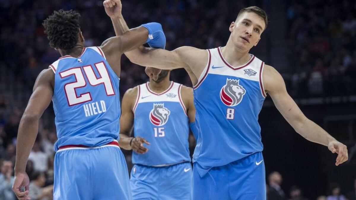 Sacramento Kings guard Buddy Hield (24) and teammate Sacramento Kings guard Bogdan Bogdanovic (8) celebrate their lede against the Chicago Bulls at the Golden 1 Center in Sacramento on Monday, Feb. 5, 2018.