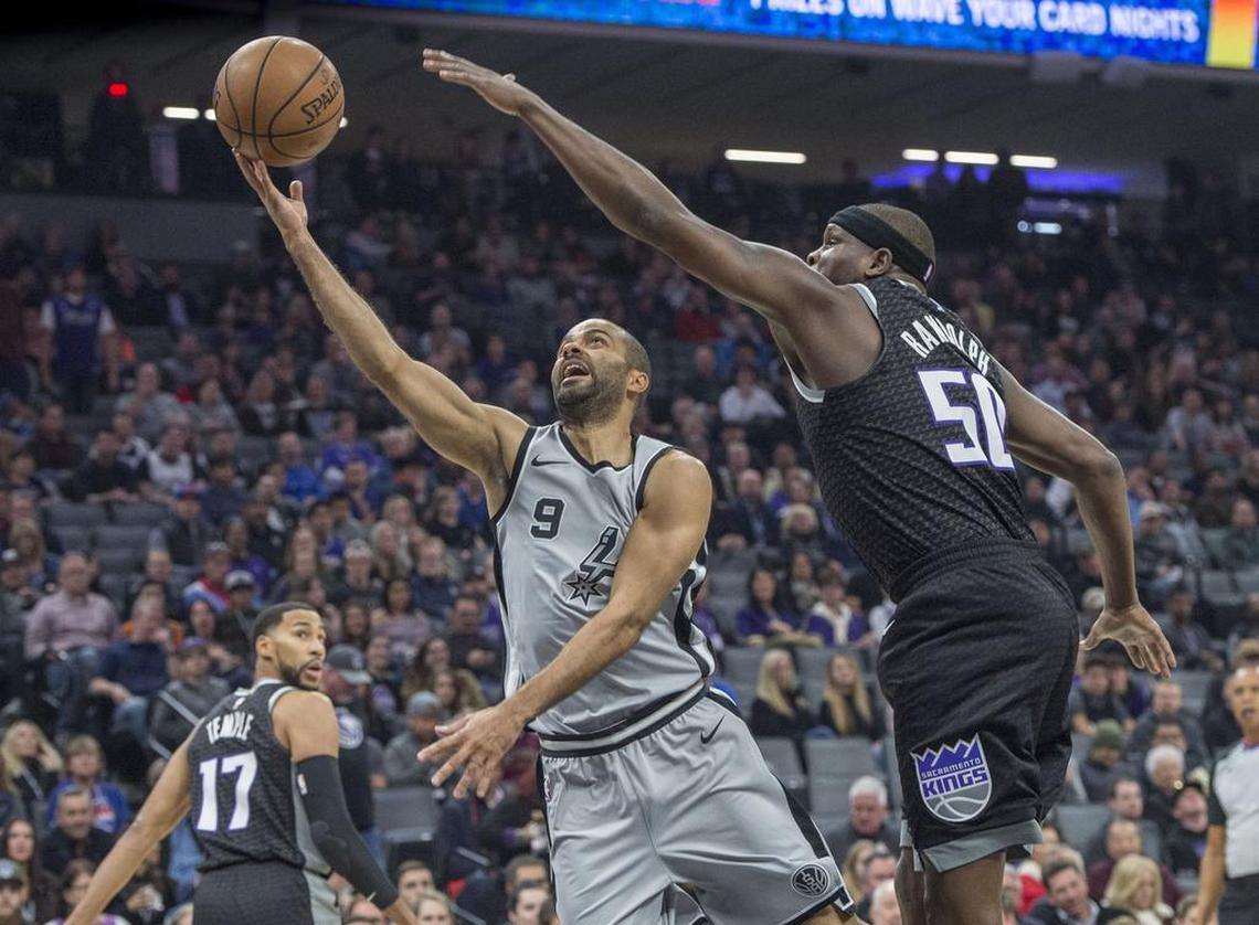 San Antonio Spurs guard Tony Parker (9) goes to the basket against Sacramento Kings forward Zach Randolph (50).