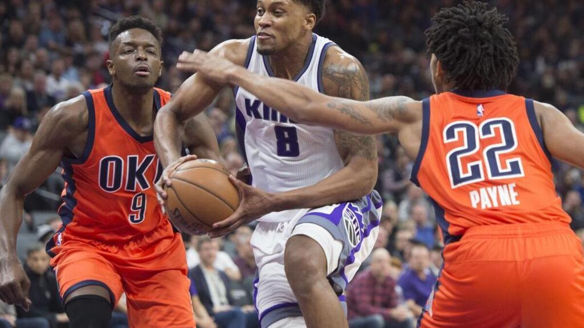 Rudy Gay drives Sacramento Kings forward Rudy Gay (8) drives to basket against Oklahoma City’s Cameron Payne and Jerami Grant at Golden 1 Center in Sacramento, California on Sunday, January 15, 2017.