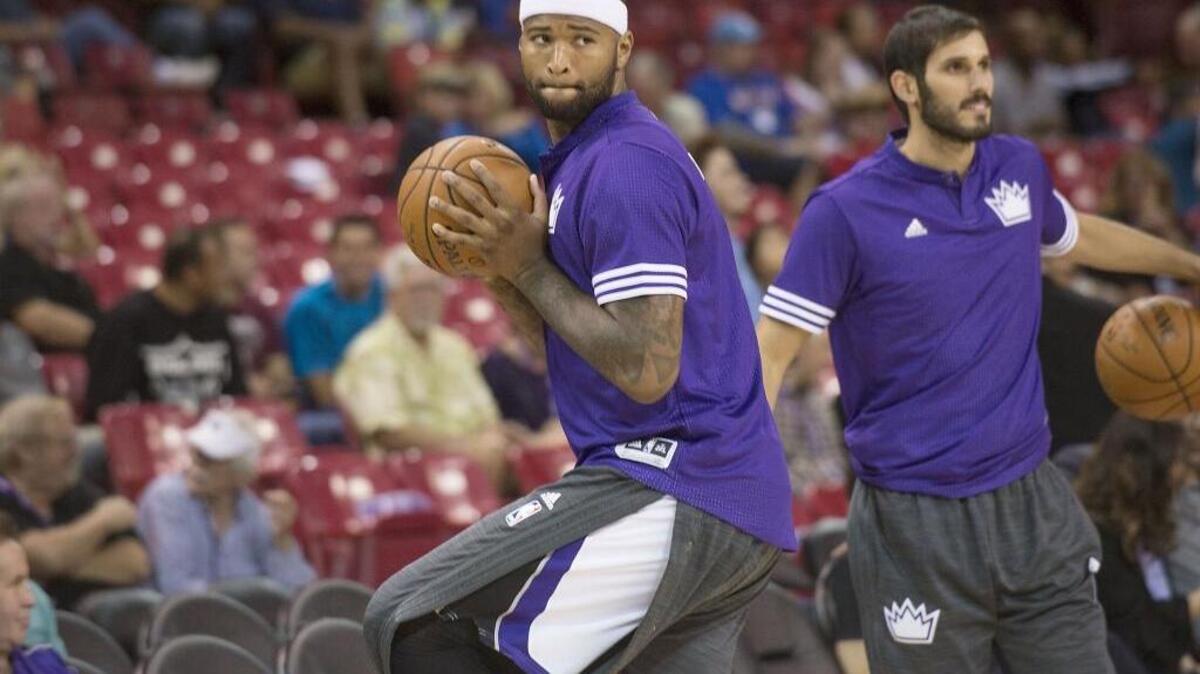Kings center DeMarcus Cousins (15) winds up like a baseball pitcher to throw the ball during warmups prior to the game between the Kings and the Portland Trail Blazers at Sleep Train Arena in Sacramento on Saturday, Oct. 10, 2015.