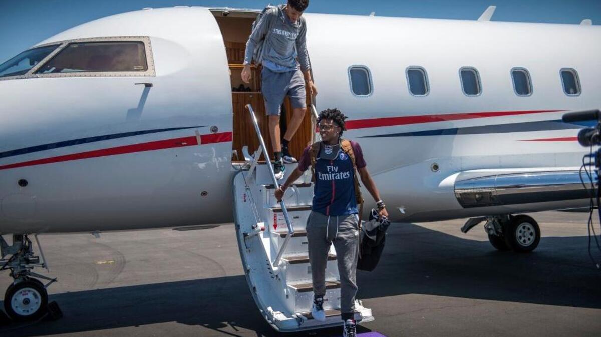 Sacramento Kings draft picks De’Aaron Fox, front, and Justin Jackson get off a private jet as they arrive in Sacramento at the Sacramento International Airport on Friday, June 23, 2017.