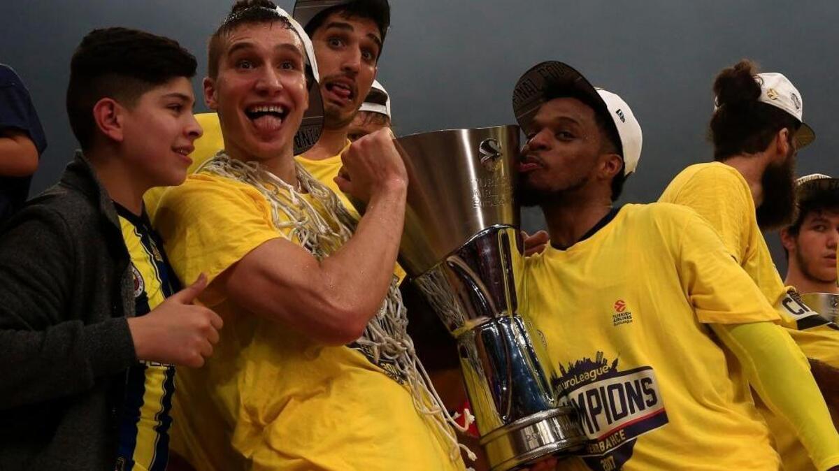 Fenerbahce Istanbul guard Bogdan Bogdanovic, second from left, and teammates hoist the EuroLeague Final Four trophy at Sinan Erdem Dome in Istanbul, Turkey on Sunday. Fenerbahce beat Olympiacos Piraeus 80-64.