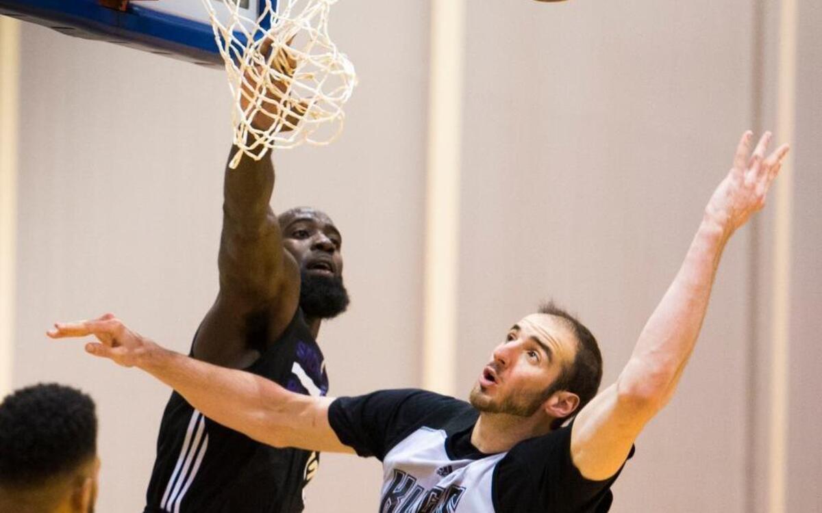 Quincy Acy defends the basket against Kings teammate Kosta Koufos (41) during training camp at UC San Diego’s RIMAC Arena on Oct. 1.