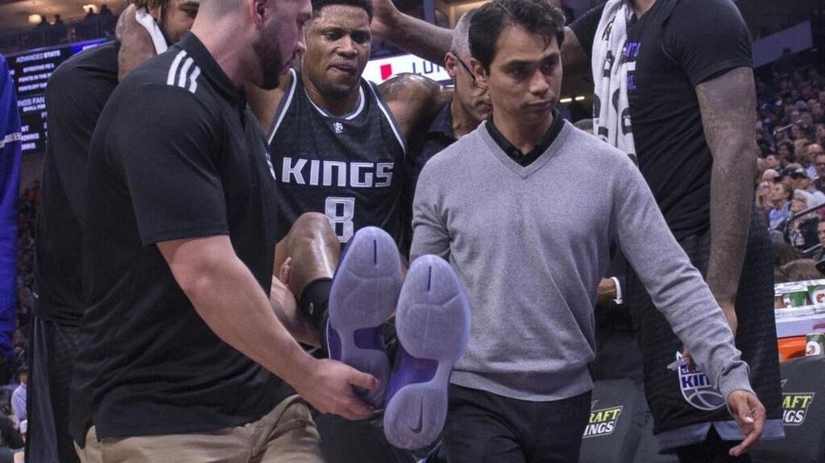 Sacramento Kings forward Rudy Gay (8) is helped off the court in the third quarter after he suffered a torn left Achilles’ tendon against the Indiana Pacers in at Golden 1 Center in Sacramento, Calif., on Wednesday, Jan. 18, 2017.