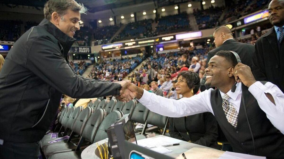Sacramento Kings majority owner Vivek Ranadive greets former Kings star Chris Webber before a game against the Chicago Bulls on Nov. 20, 2014, at Sleep Train Arena in Sacramento, Calif.