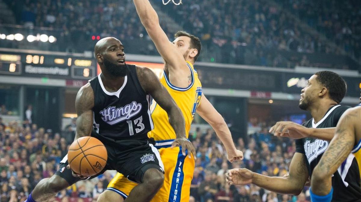 Kings forward Quincy Acy (13) looks to pass as he’s defended by Golden State Warriors center Andrew Bogut on Saturday, Jan. 9, 2016, at Sleep Train Arena in Sacramento, Calif.