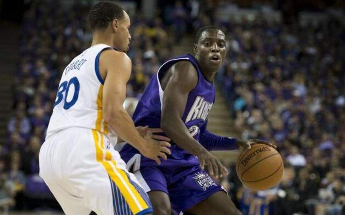 
Sacramento Kings guard Darren Collison (7) and Golden State Warriors guard Stephen Curry (30), going one-on-one during their 2014 NBA season opener in October, will face each other again as the Kings play the Warriors on Monday night at Oracle Arena in Oakland.
