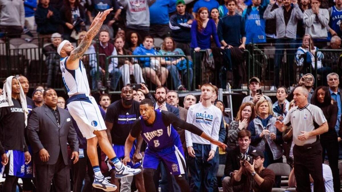 Dallas Mavericks guard Deron Williams (8) shoots a three-pointer in the final second of the second overtime in an NBA basketball game against the Sacramento Kings on Tuesday, Jan. 5, 2016, in Dallas.