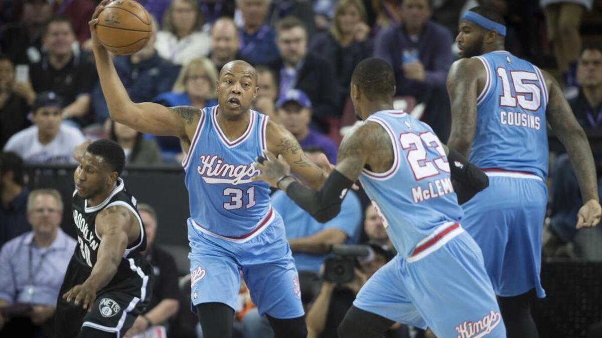 Sacramento Kings forward Caron Butler (31) steals the ball against the Brooklyn Nets forward Thaddeus Young (30) passes the ball to teammate Sacramento Kings guard Ben McLemore (23) at Sleep Train Arena in Sacramento on Friday, Nov. 13, 2015.