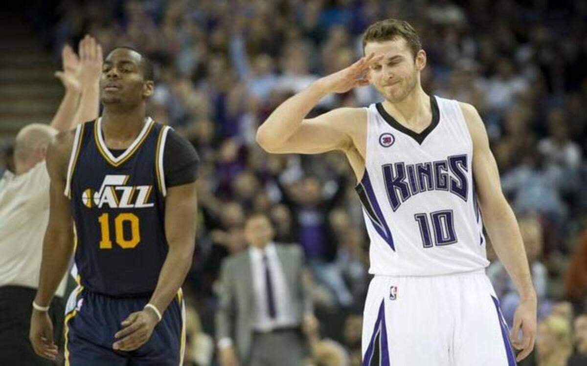 
Sacramento Kings guard Nik Stauskas (10) celebrates a three-point basket against Utah Jazz guard Alec Burks (10) during the Kings 101-92 victory on Monday, Dec. 8, 2014, at Sleep Train Arena in Sacramento.
