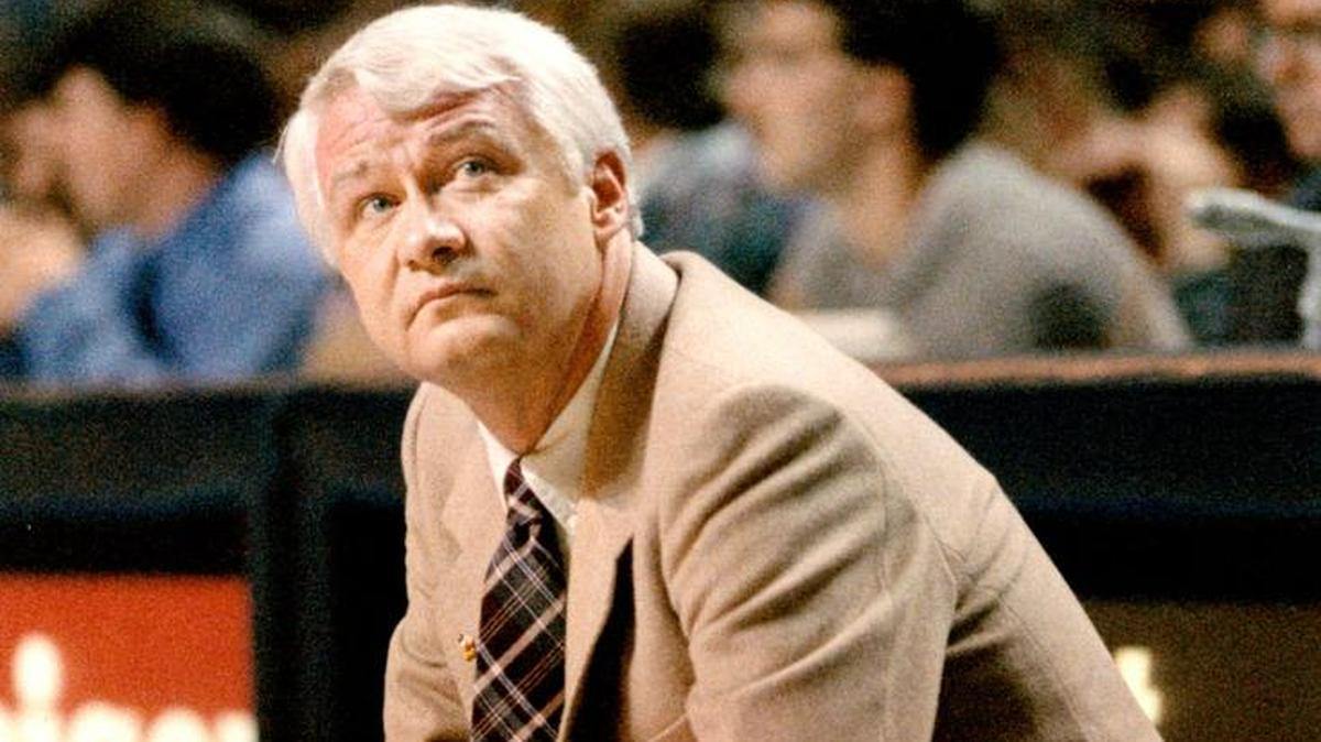 Kings coach Jerry Reynolds crouches on the court during a game against the Phoenix Suns during the 1988-89 season.