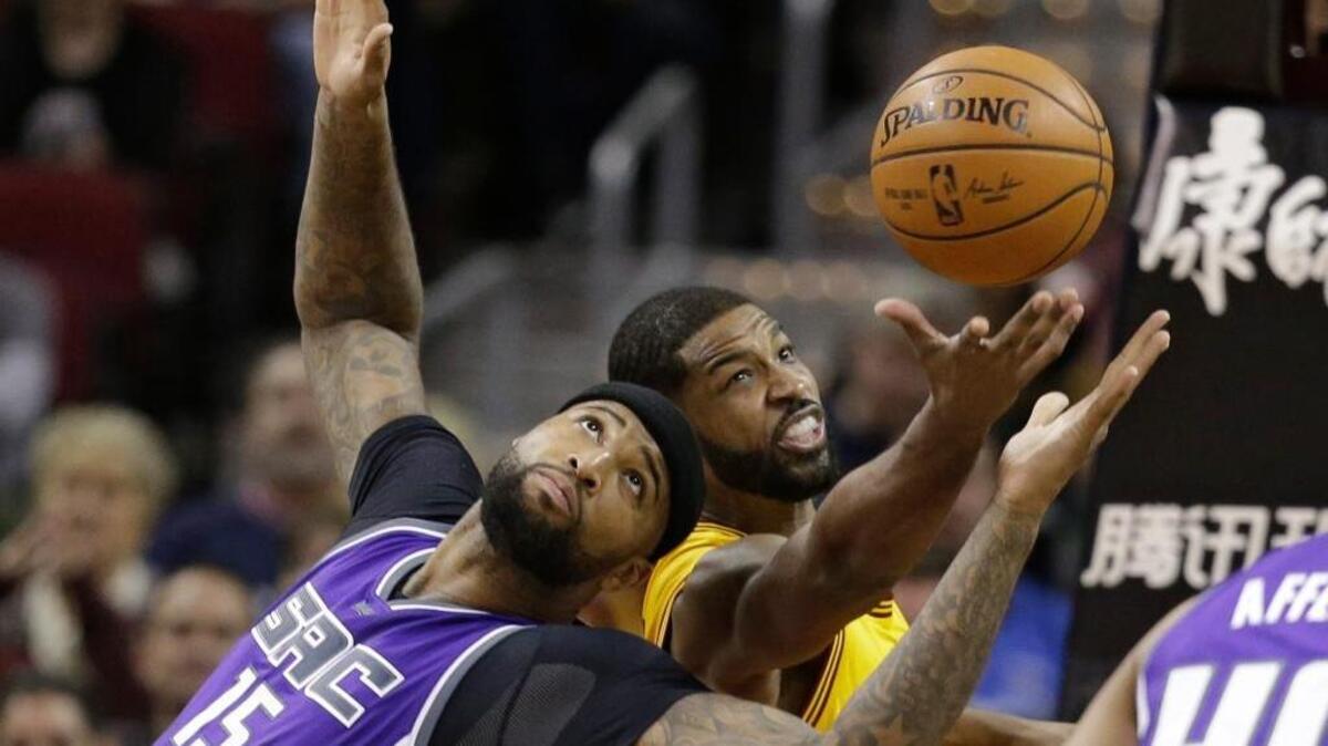 The Kings’ DeMarcus Cousins (15) and Cleveland Cavaliers’ Tristan Thompson battle for a loose ball during the first half in Cleveland, Wednesday, Jan. 25, 2017. The Kings won 116-112.