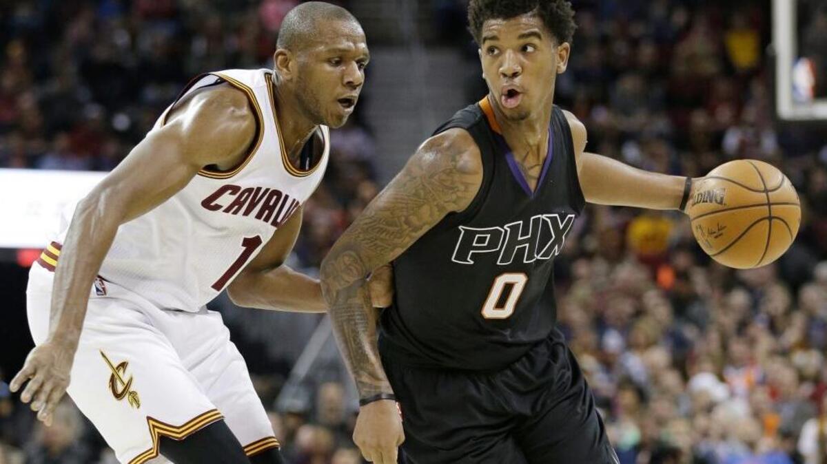 Phoenix Suns’ Marquese Chriss (0) drives against Cleveland Cavaliers’ James Jones (1) on Jan. 19, 2017, in Cleveland.