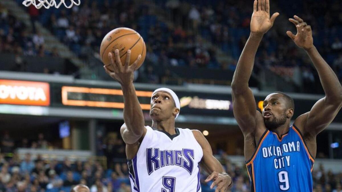 Sacramento Kings guard Rajon Rondo (9) scores as Oklahoma City Thunder forward Serge Ibaka defends during an NBA basketball game on Monday, Feb. 29, 2016 at Sleep Train Arena in Sacramento. Rondo had a team-high 12 assists and scored 11 points.