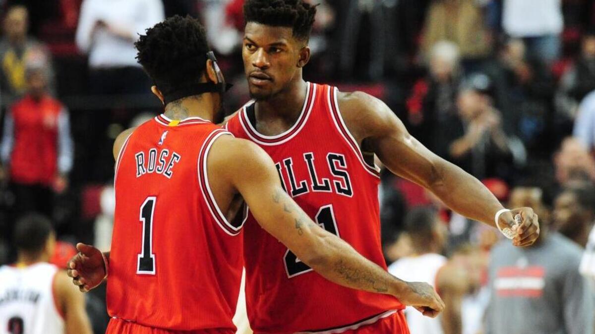 Chicago Bulls guard Derrick Rose (1) and guard Jimmy Butler (21) celebrate after an NBA basketball game against the Portland Trail Blazers in Portland, Ore., Tuesday, Nov. 24, 2015. The Kings will need to keep tabs on both in Wednesday’s game