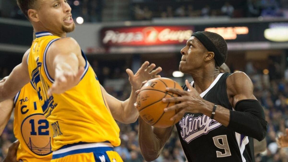 Sacramento Kings guard Rajon Rondo (9) drives to the basket against the Golden State Warriors guard Stephen Curry (30) during an NBA basketball game on Saturday, Jan. 9, 2016 at Sleep Train Arena in Sacramento.