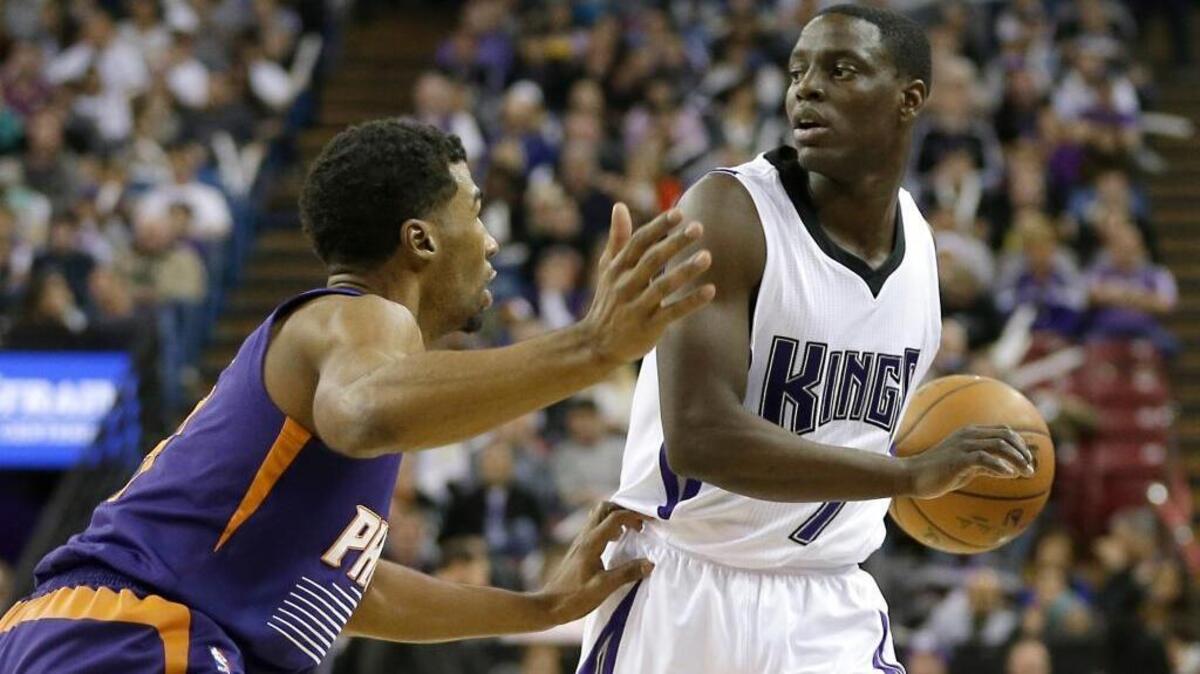 The Sacramento Kings’ Darren Collison, right, is guarded by Ronnie Price of the Phoenix Suns during an NBA basketball game Saturday, Jan. 2, 2016, in Sacramento. Collison scored 21 points off the bench on 7-of-10 shooting.