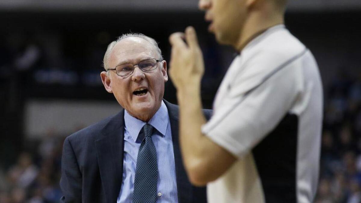 Sacramento Kings coach George Karl questions a referee during the first half of the team's NBA basketball game against the Dallas Mavericks on Tuesday, Jan. 5, 2016, in Dallas.