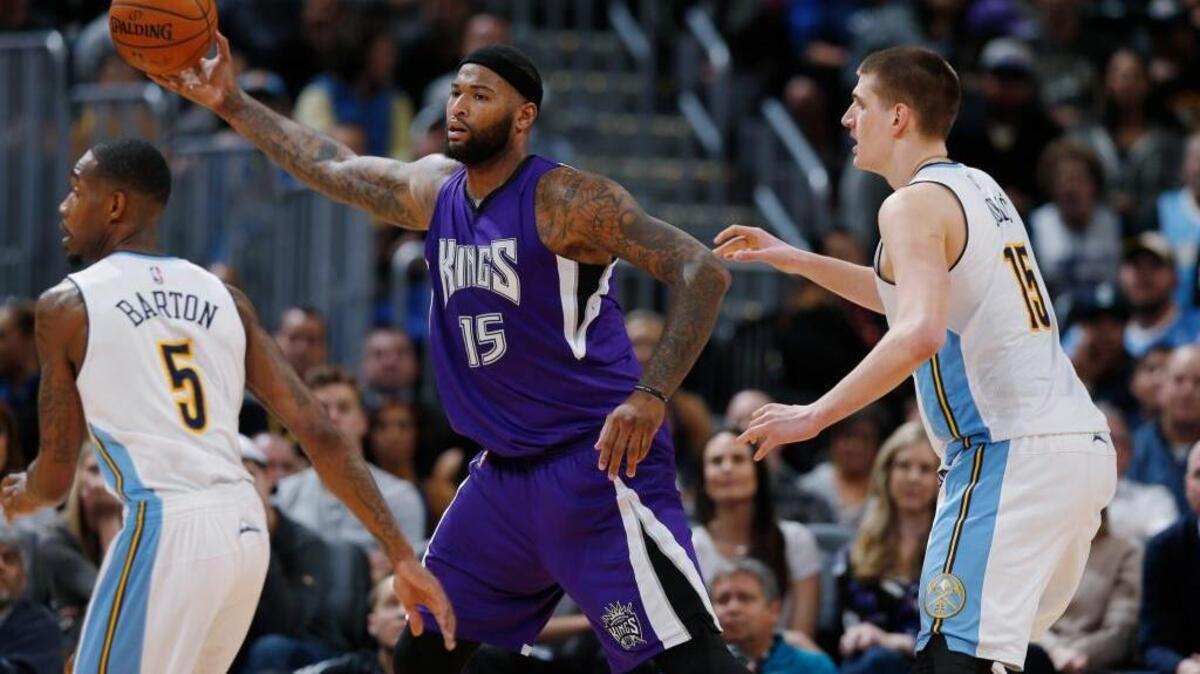 Sacramento Kings center DeMarcus Cousins, center, scores a game-high 39 points as the Kings defeat the Denver Nuggets 114-110 for their third win in a row. ... Denver Nuggets forward Will Barton, left, and center Nikola Jokic, defend Cousins late in the second half of an NBA basketball game Tuesday, Feb. 23, 2016, in Denver.