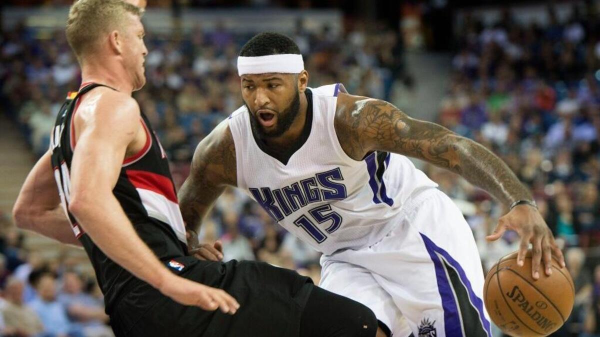 Sacramento Kings center DeMarcus Cousins (15) drives against Portland Trail Blazers center Mason Plumlee (24) but is called for an offensive foul on play during an NBA basketball game on Tuesday, April 5, 2016 at Sleep Train Arena in Sacramento.