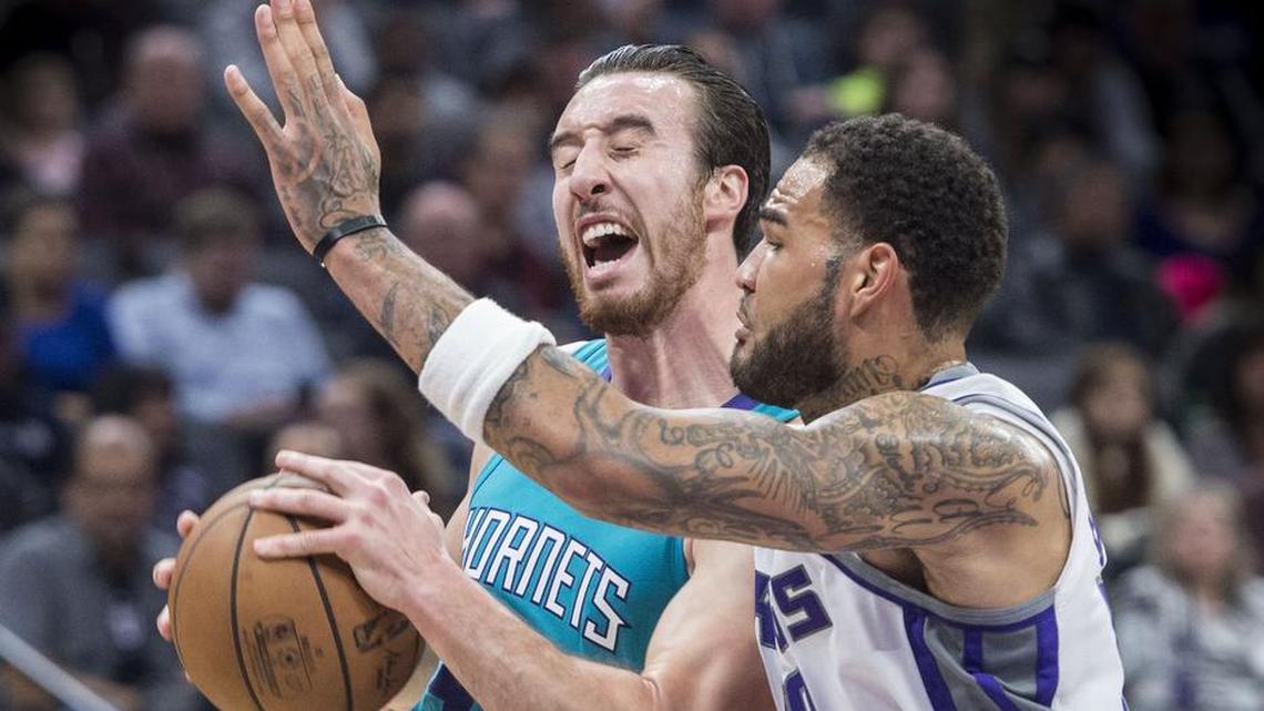 Kings center Willie Cauley-Stein (00) defends Charlotte Hornets forward Frank Kaminsky (44) as drives to the basket on Tuesday, Jan. 2, 2018 at the Golden 1 Center in Sacramento, Calif..