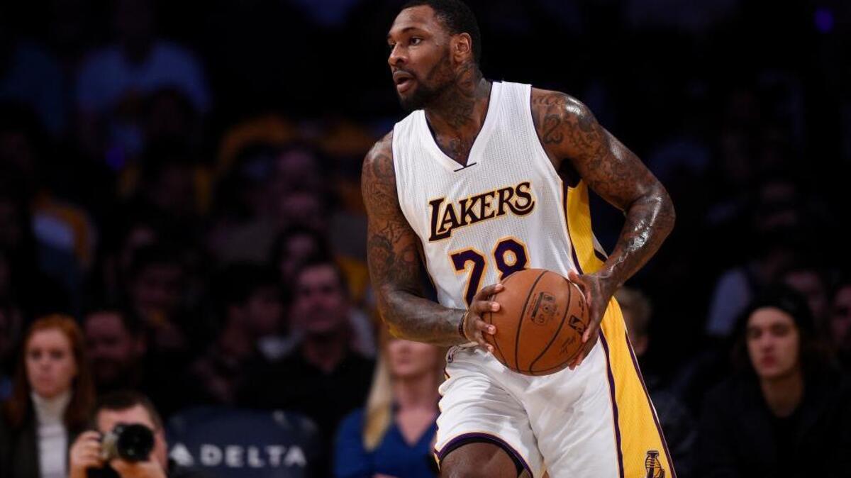 Los Angeles Lakers center Tarik Black looks to pass during an NBA basketball game against the Toronto Raptors, Sunday, Jan. 1, 2017 in Los Angeles. He is receiving more playing time since the Lakers benched Timofey Mozgov.