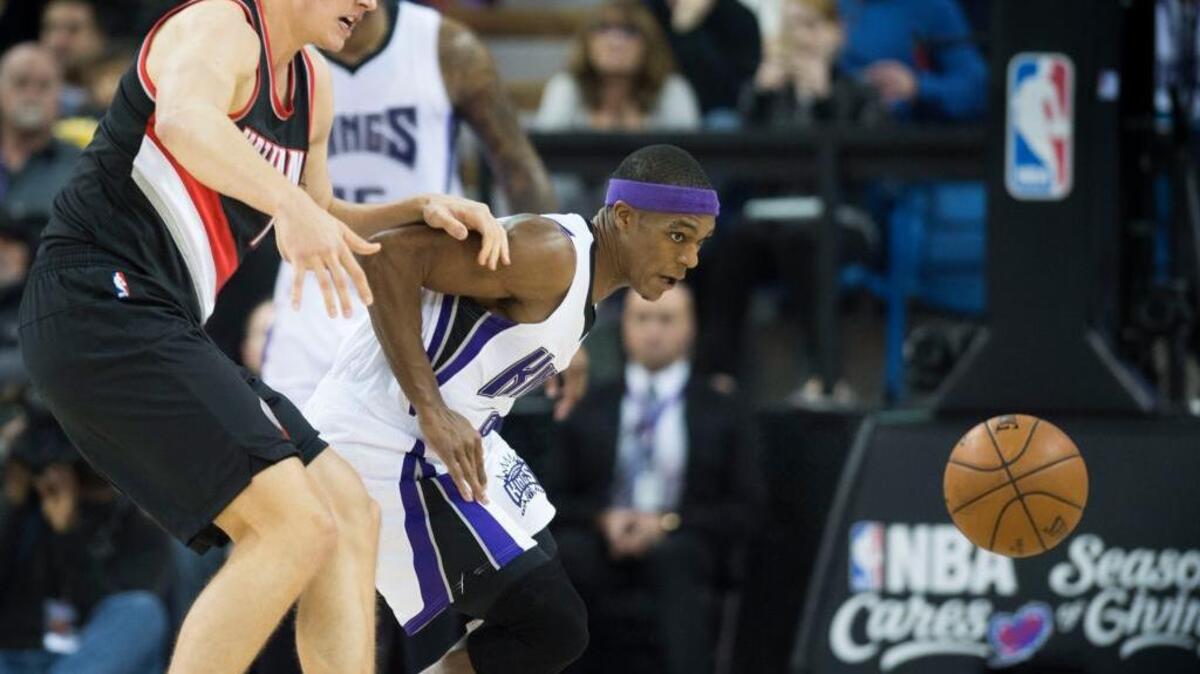 Sacramento Kings guard Rajon Rondo (9) Portland Trail Blazers Meyers Leonard pursue a loose ball during an NBA basketball game on Sunday, Dec. 27, 2015 at Sleep Train Arena in Sacramento. Rondo had eight of the Kings’ 22 turnovers in the loss to Portland.