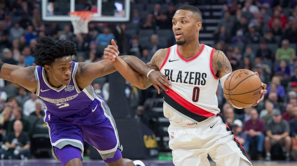 Portland Trail Blazers guard Damian Lillard drives past Kings guard De’Aaron Fox on Nov. 17 at Golden 1 Center. Lillard, a two-time All-Star told a Twitter follower he thought he’d be drafted by Sacramento in 2012.