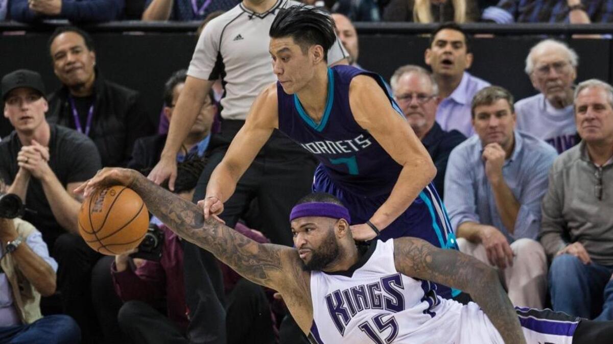 Kings center DeMarcus Cousins scrambles for the ball with Charlotte Hornets guard Jeremy Lin on Monday, January 25, 2016 at Sleep Train Arena in Sacramento. Cousins scored a career-high 56 points during the Kings’ 129-128 double overtime loss.