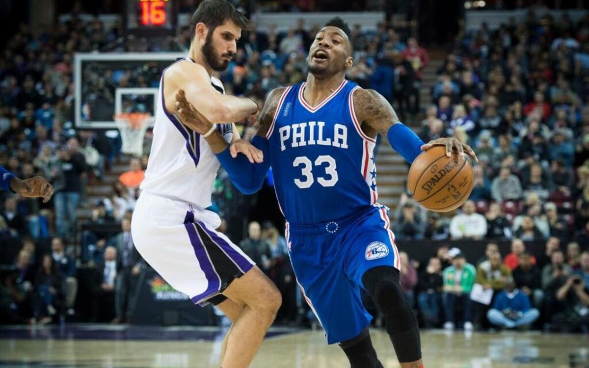 Sacramento Kings forward Omri Casspi (18) fouls Philadelphia 76ers forward Robert Covington (33) on Wednesday, Dec. 30, 2015 at Sleep Train Arena in Sacramento. The Kings lost to the 76ers, who came into the game 2-31.