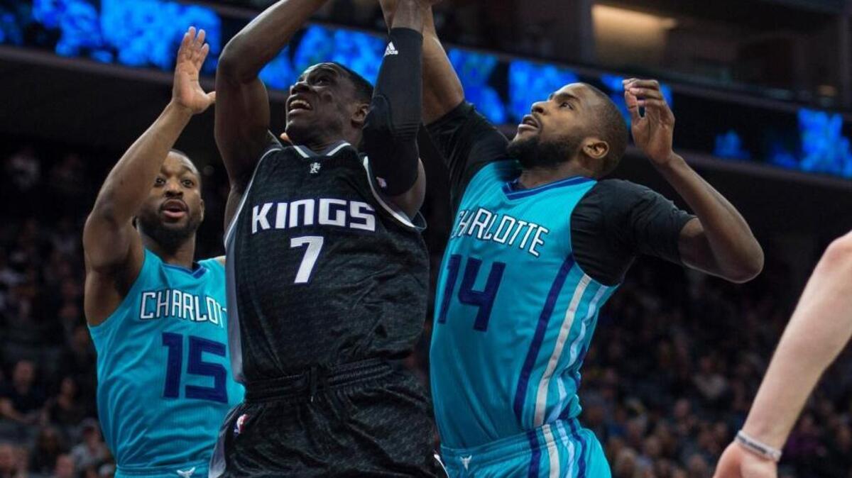 Charlotte’s Michael Kidd-Gilchrist (14) and Kemba Walker (15) try to stop Darren Collison of the Kings on Saturday, Feb. 25, 2017, at Golden 1 Center in Sacramento.