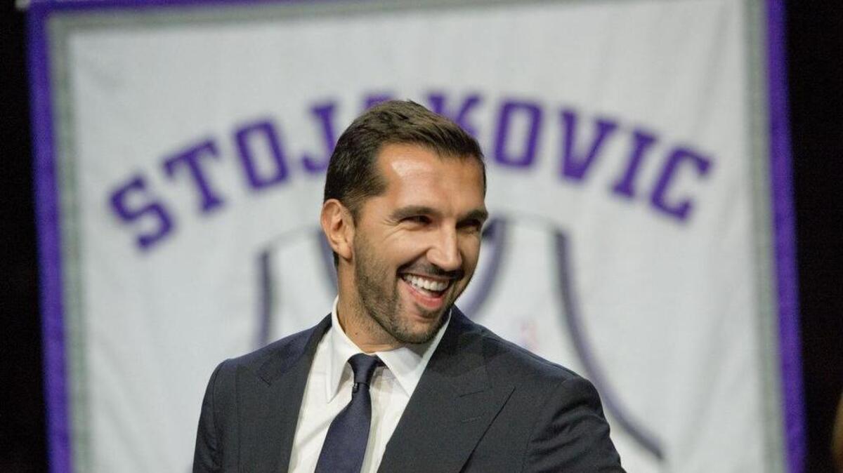 
Peja Stojakovic smiles at his former teammates as his jersey is retired at Sleep Train Arena on Tuesday, Dec. 16, 2014 in Sacramento, Calif.
