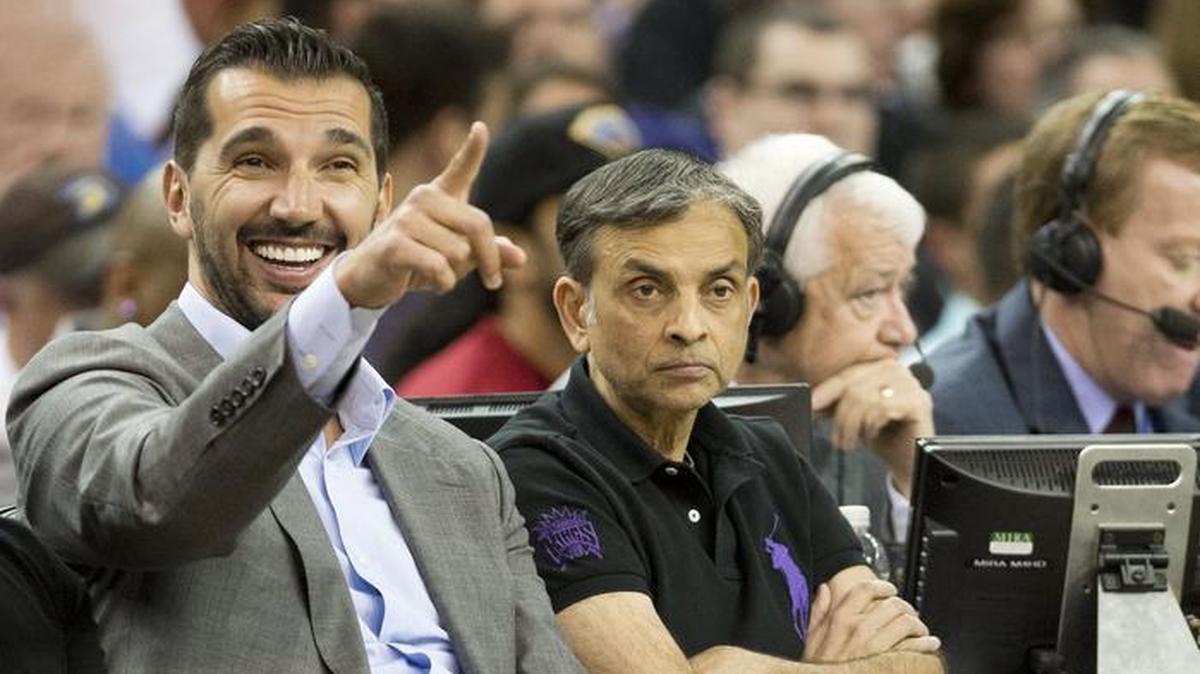 Peja Stojakovic points as he sits next to Sacramento Kings owner Vivek Ranadive during the game against the Dallas Mavericks at the Sleep Train Arena on April 6, 2014.
